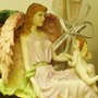 Angel with baby lamp